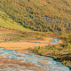 Blue glacier river in autum valley